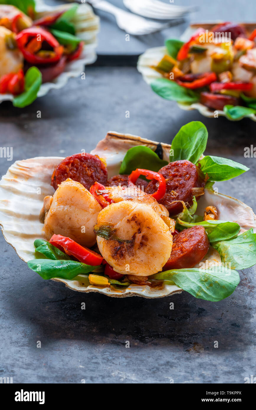 Spiced scallops with chorizo and chili in shells Stock Photo Alamy