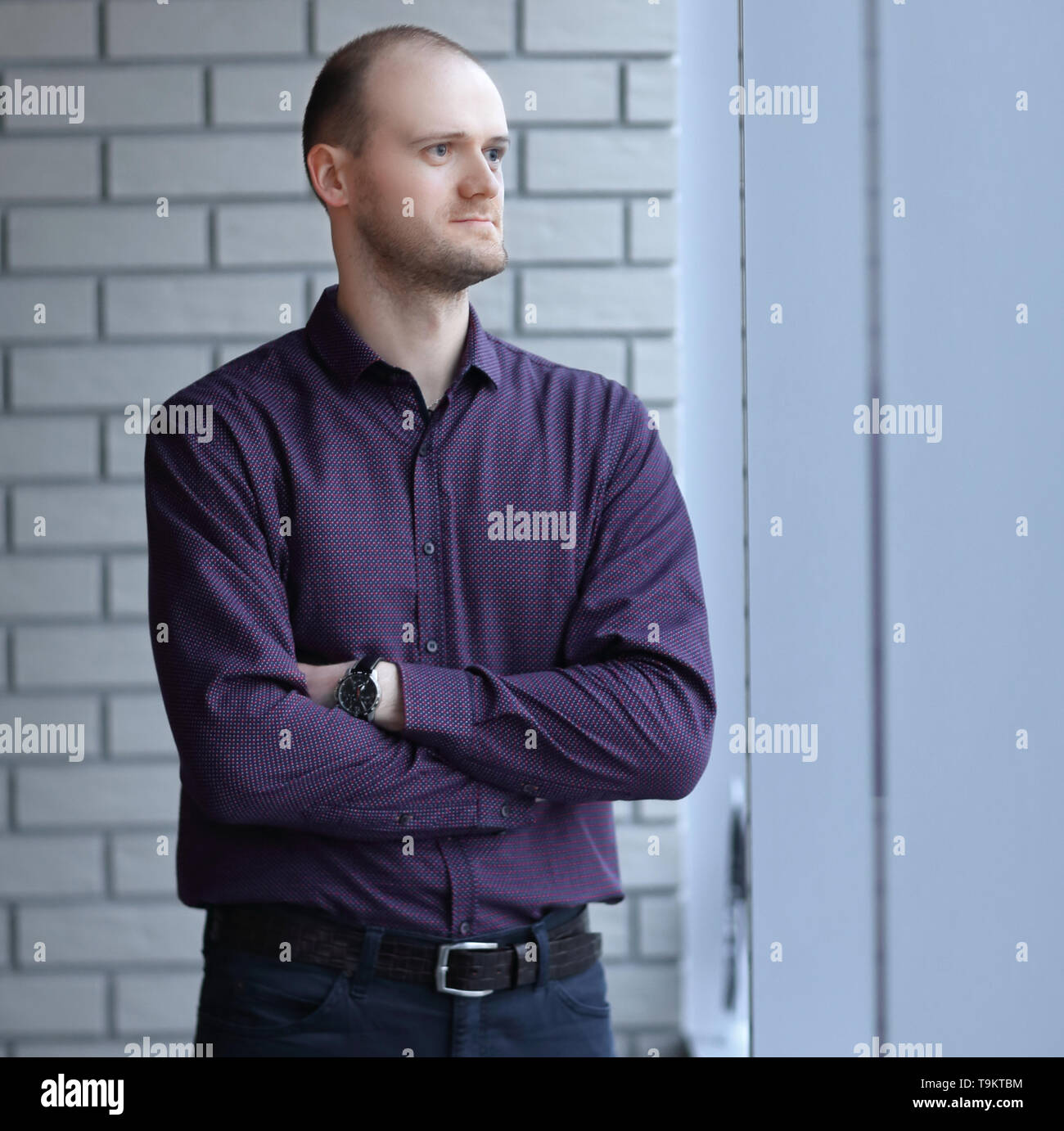pensive businessman looking out office window.business people Stock