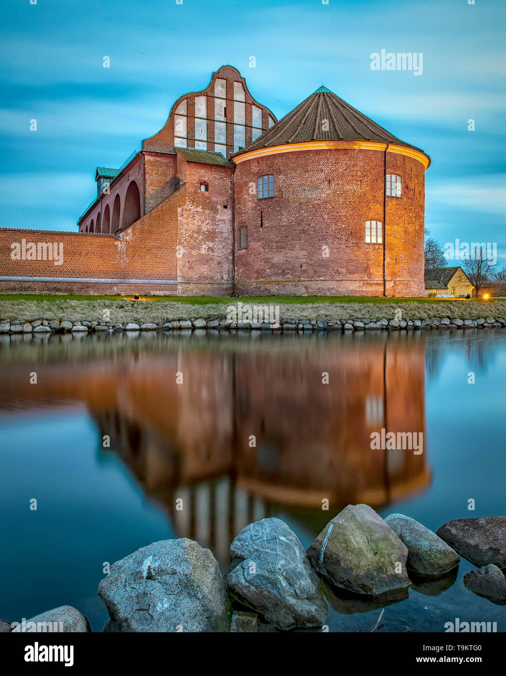After the sun has set, Landskrona citadel looks beautiful in the blue hour light. Stock Photo