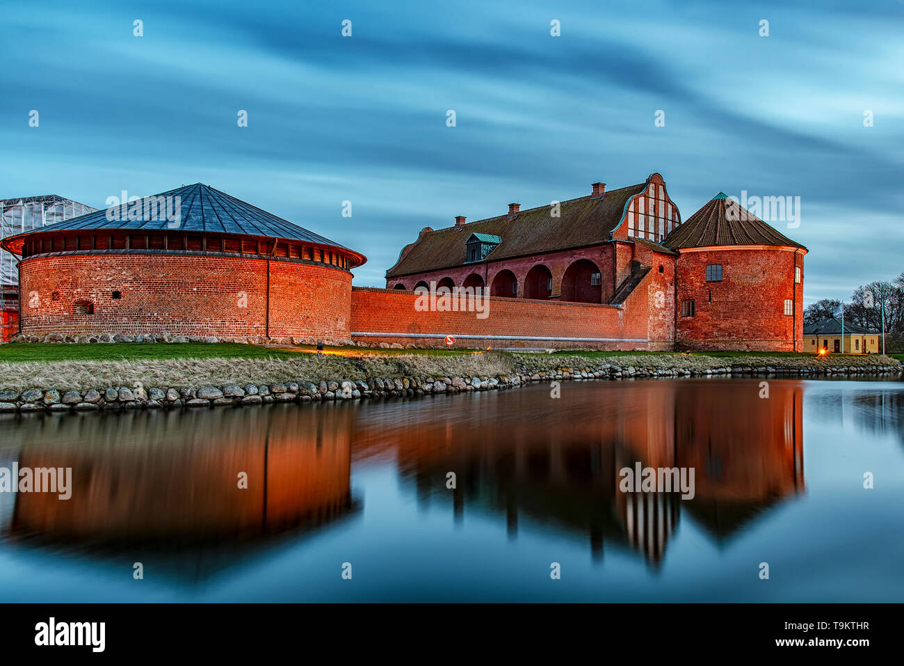 After the sun has set, Landskrona citadel looks beautiful in the blue hour light. Stock Photo