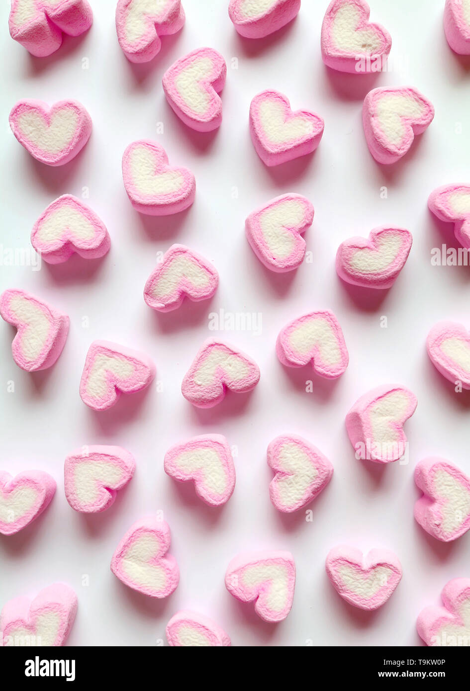 Vertical Image of Pastel Pink and White Heart Shaped Marshmallow