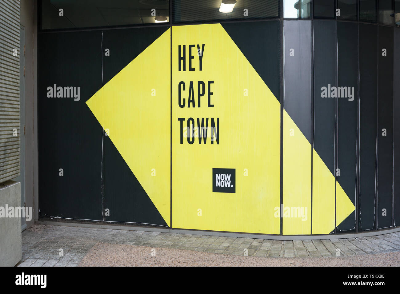 large advert or graphic poster in a window with the words or text Hey