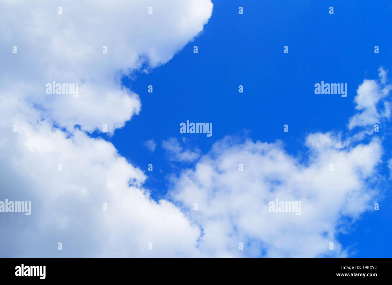 Beautiful blue sky background with white fluffy clouds Stock Photo - Alamy