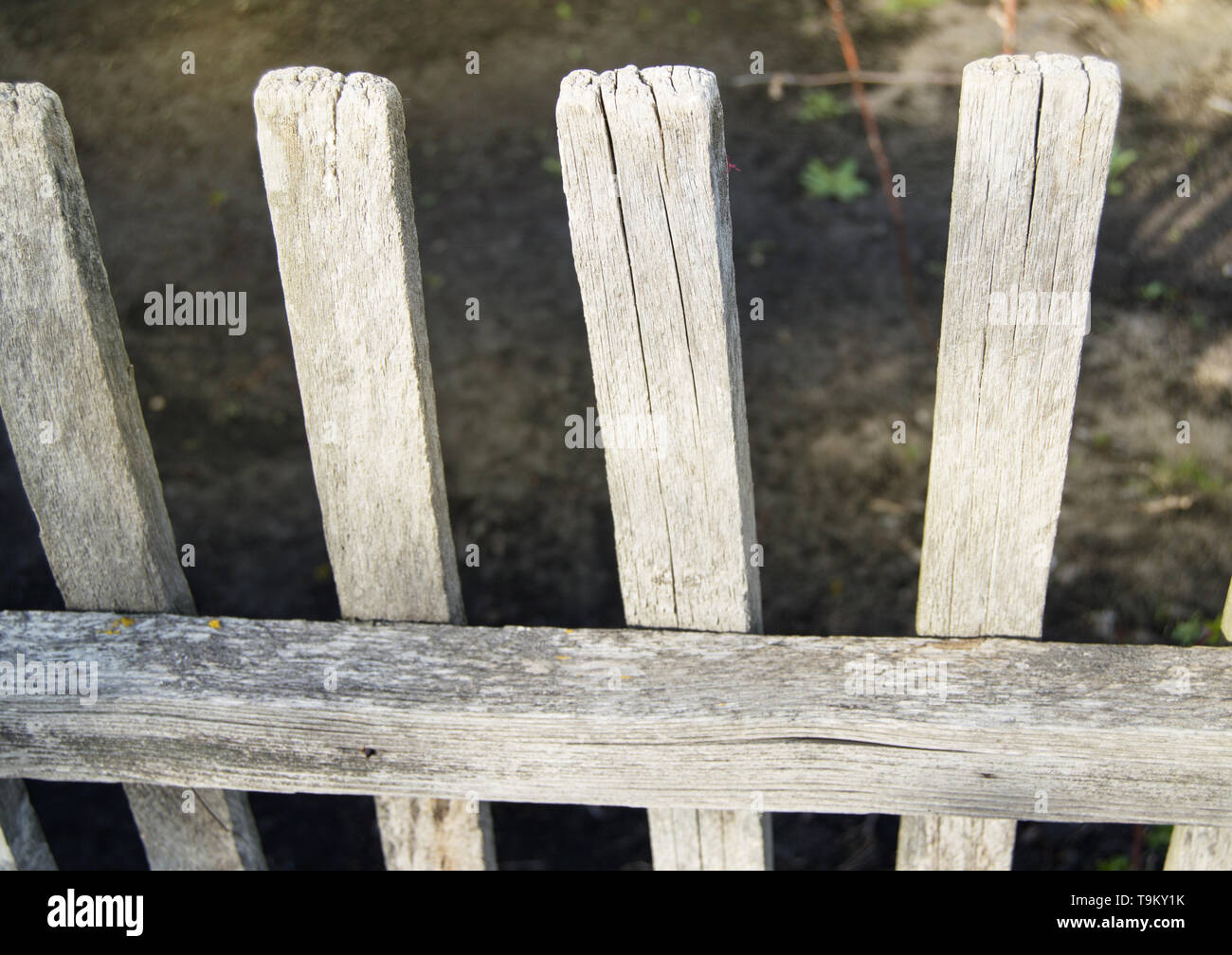 Old gray wooden fence from the cracked boards Stock Photo - Alamy