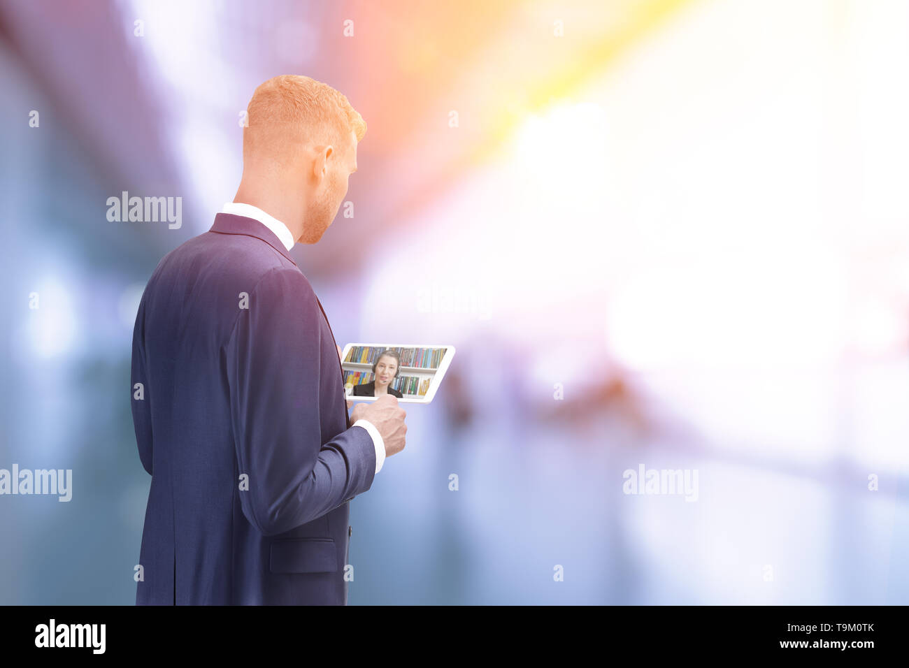 Man in office building making an online phone call with tablet computer, text or copy space Stock Photo