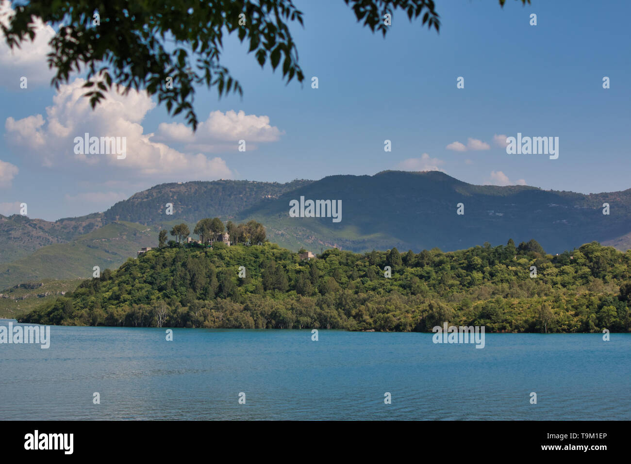 Khanpur, Pakistan - May 2019: A view of a lake next to the mountains Stock Photo