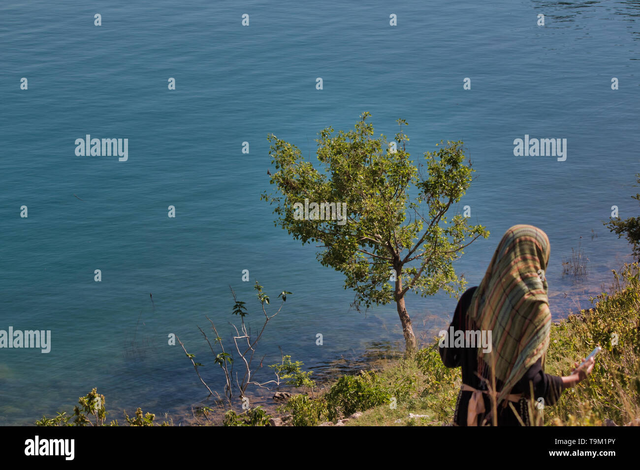 Khanpur, Pakistan - May 2019: A view of a lake next to the mountains Stock Photo