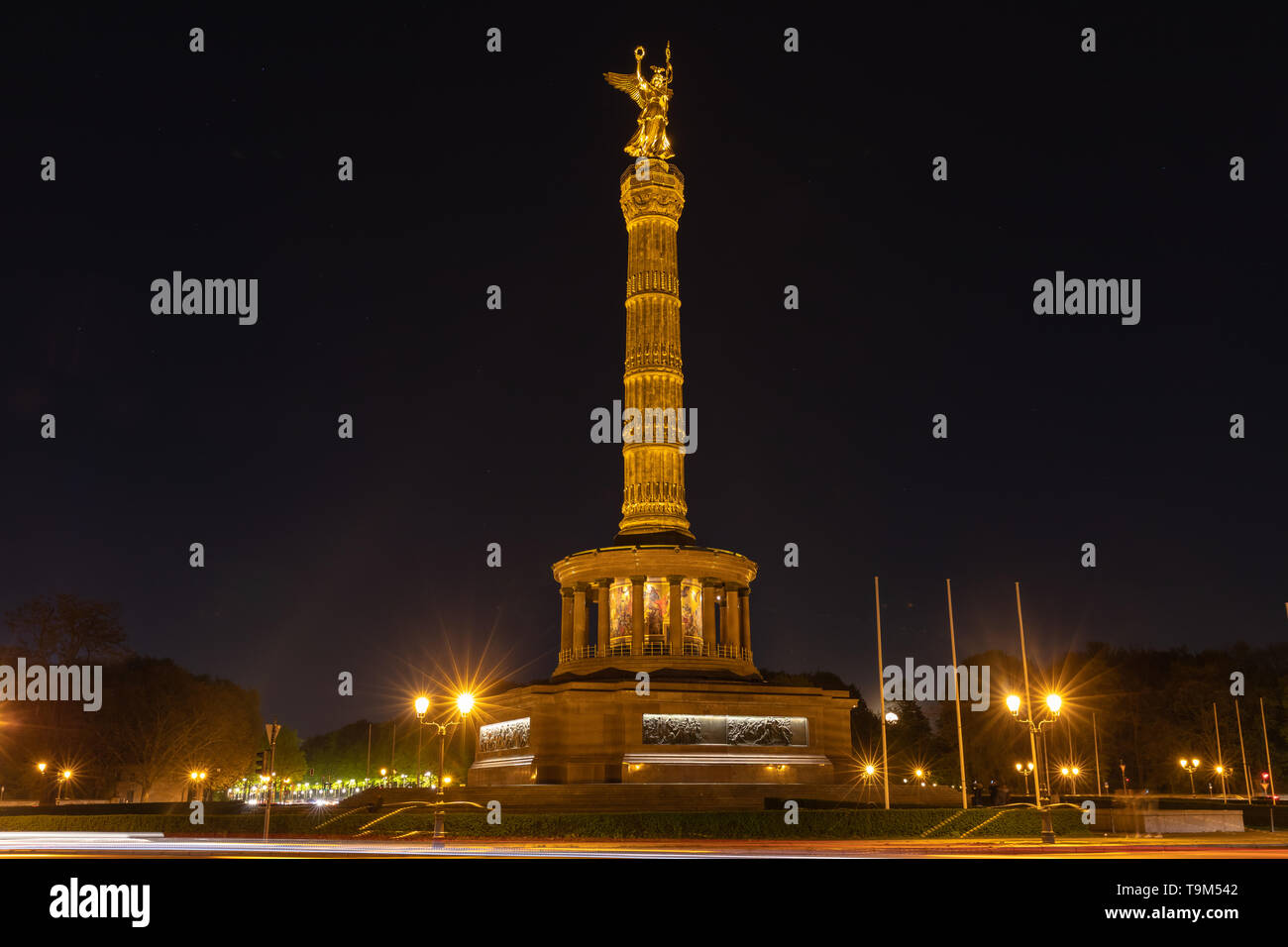 Night view of the Victory Column with the golden statue of Victoria on top, located at Great Star square in Berlin, Germany Stock Photo