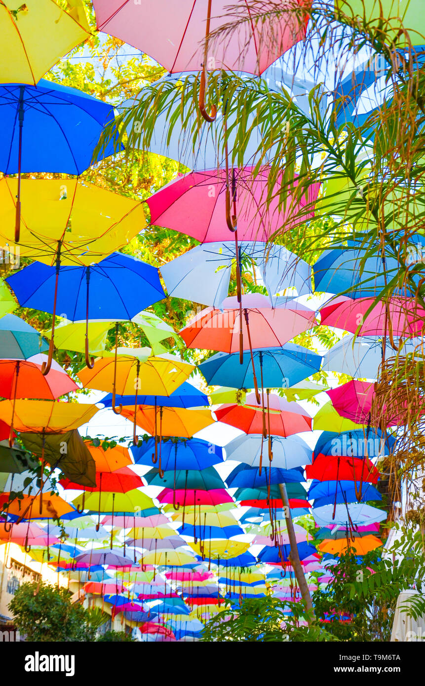 Beautiful colorful umbrellas as a decor of the street in Nicosia, Northern Cyprus. The umbrella serves also as a shade and protection against the sun. Stock Photo