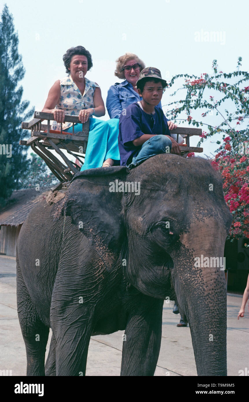 Thailand. Nakhon Pathom Province. Sam Phran.  Sampran Riverside Rose Garden Thai Village. Tourists on Elephant ride. Stock Photo