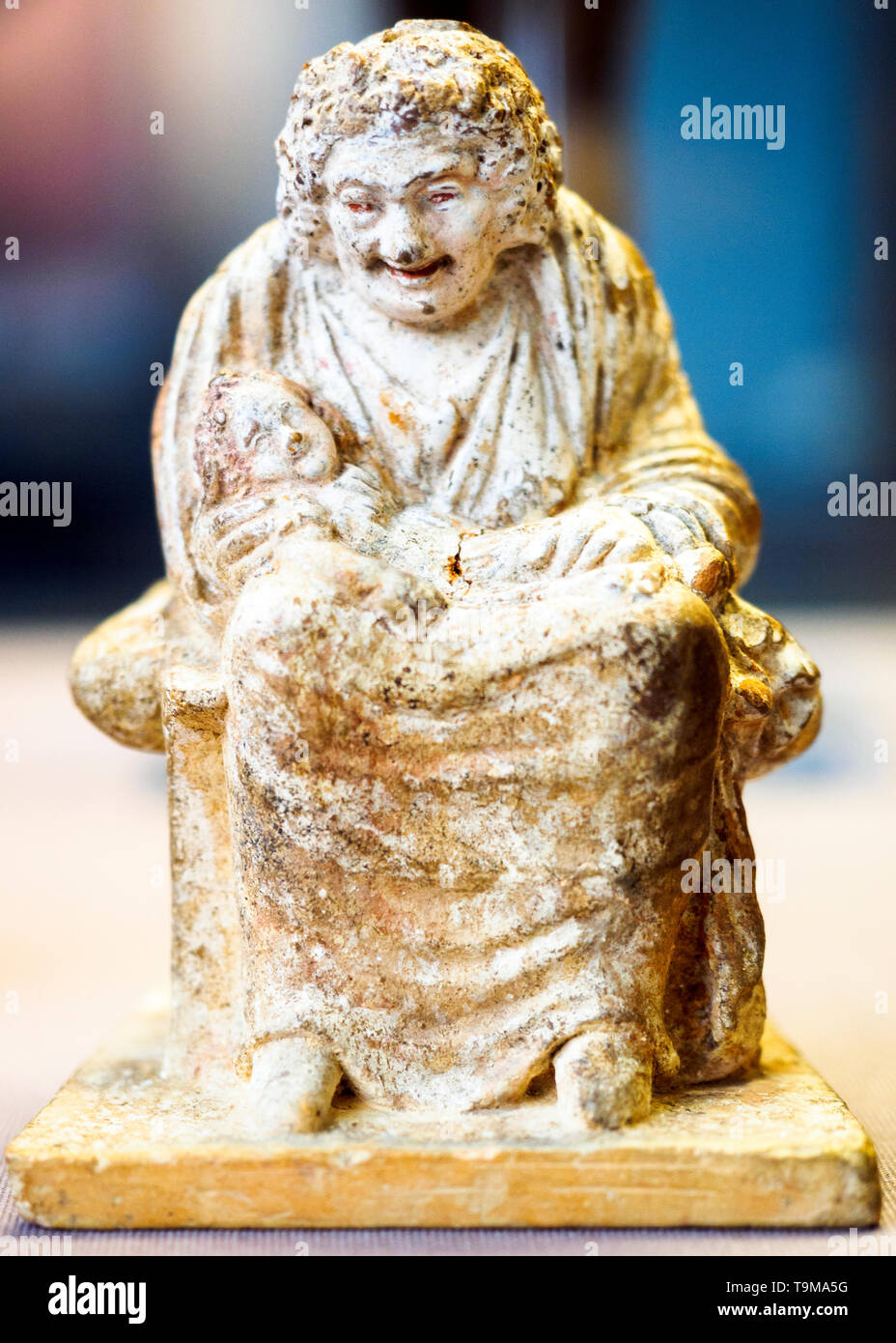 An old nurse cradles a baby in her arms Found in Boeotia, Greece about 330 - 300 BC Stock Photo