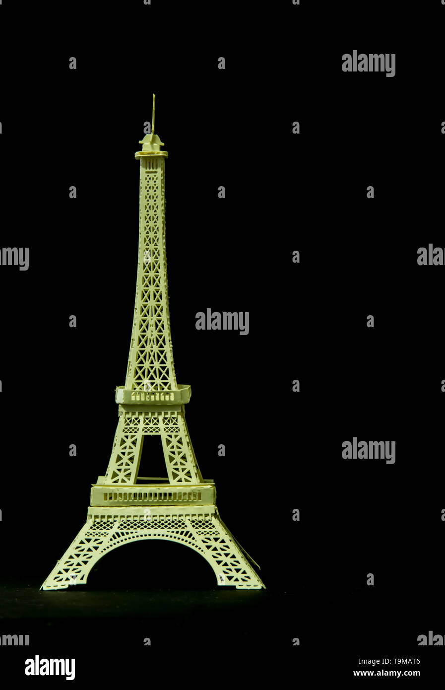 A model Eiffel tower paper toy display on black background Stock Photo