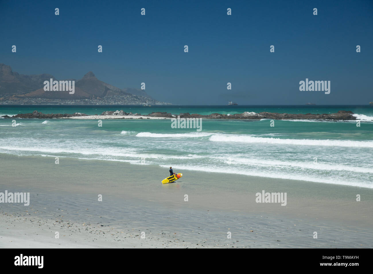 A surfer at the Western Cape in Cape Town, South Africa Stock Photo