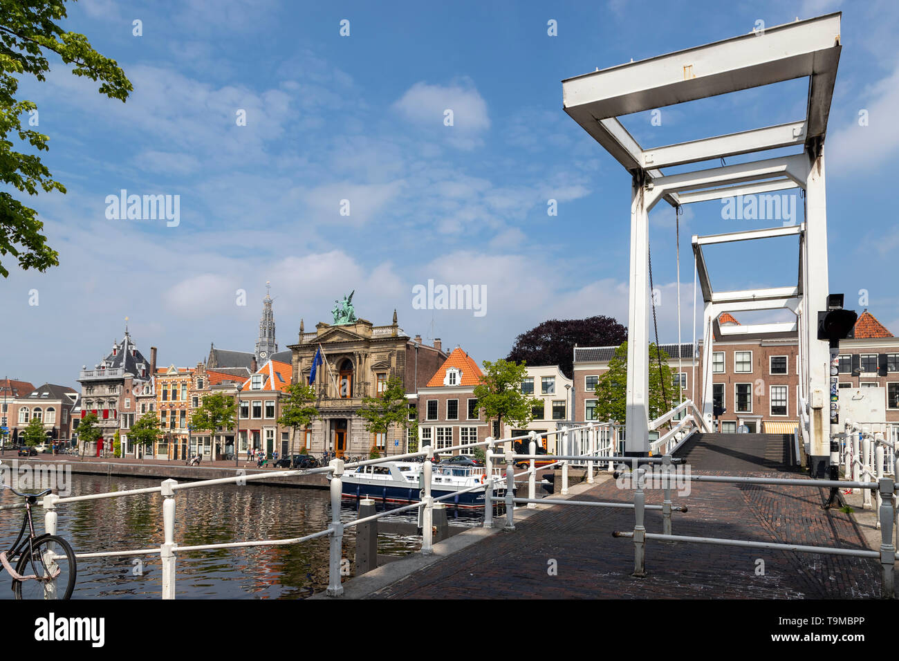 Gravestenenbrug, a famous drawbridge across River Spaarne with view of the Teylers Museum on Spaarne, Haarlem, North Holland, The Netherlands. Stock Photo