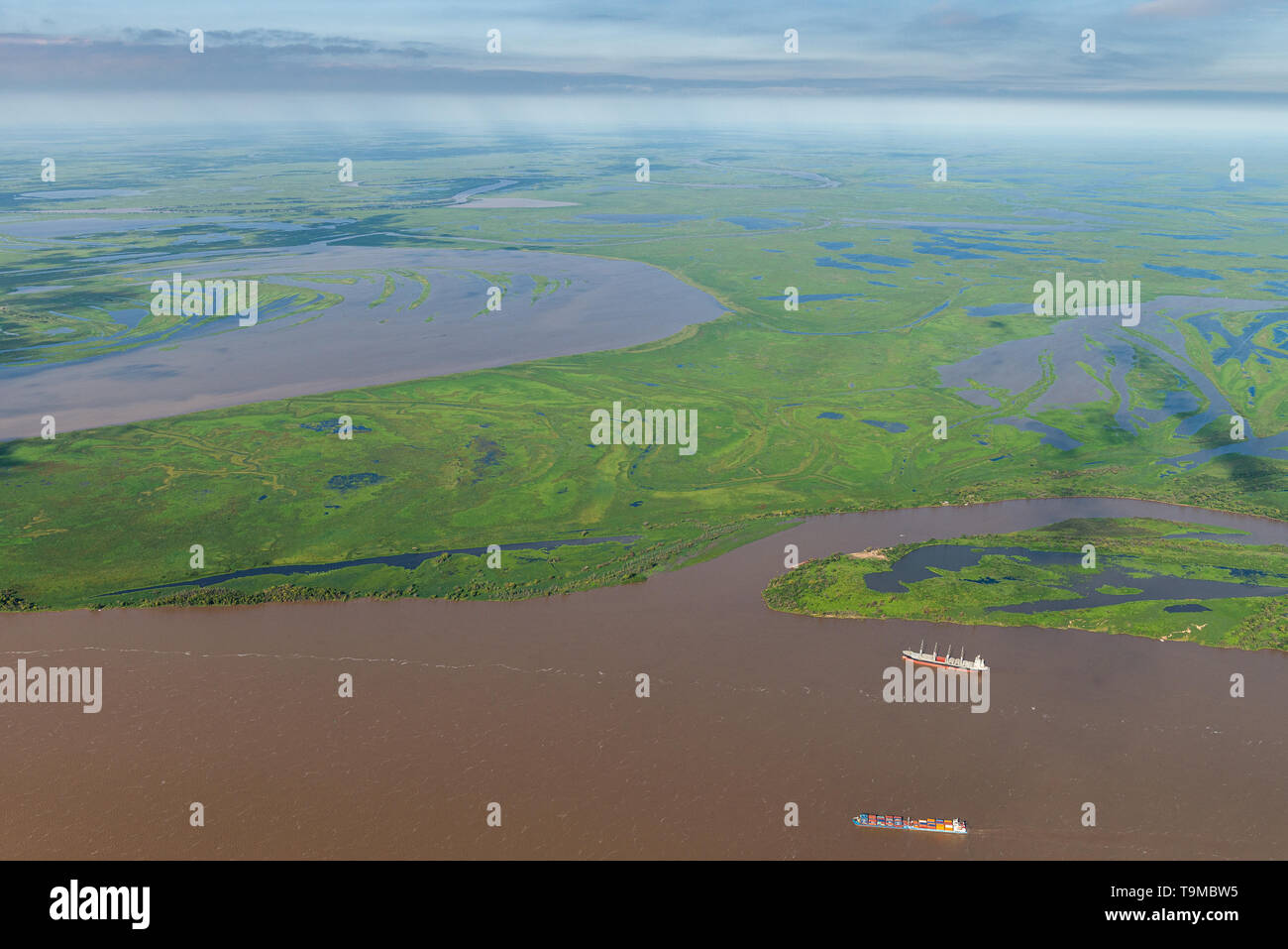 Aerial image of cargo vessels on the ParanÃ¡ Delta (Spanish: Delta del ParanÃ¡) is the delta of the ParanÃ¡ River in Argentina and it consists of seve Stock Photo