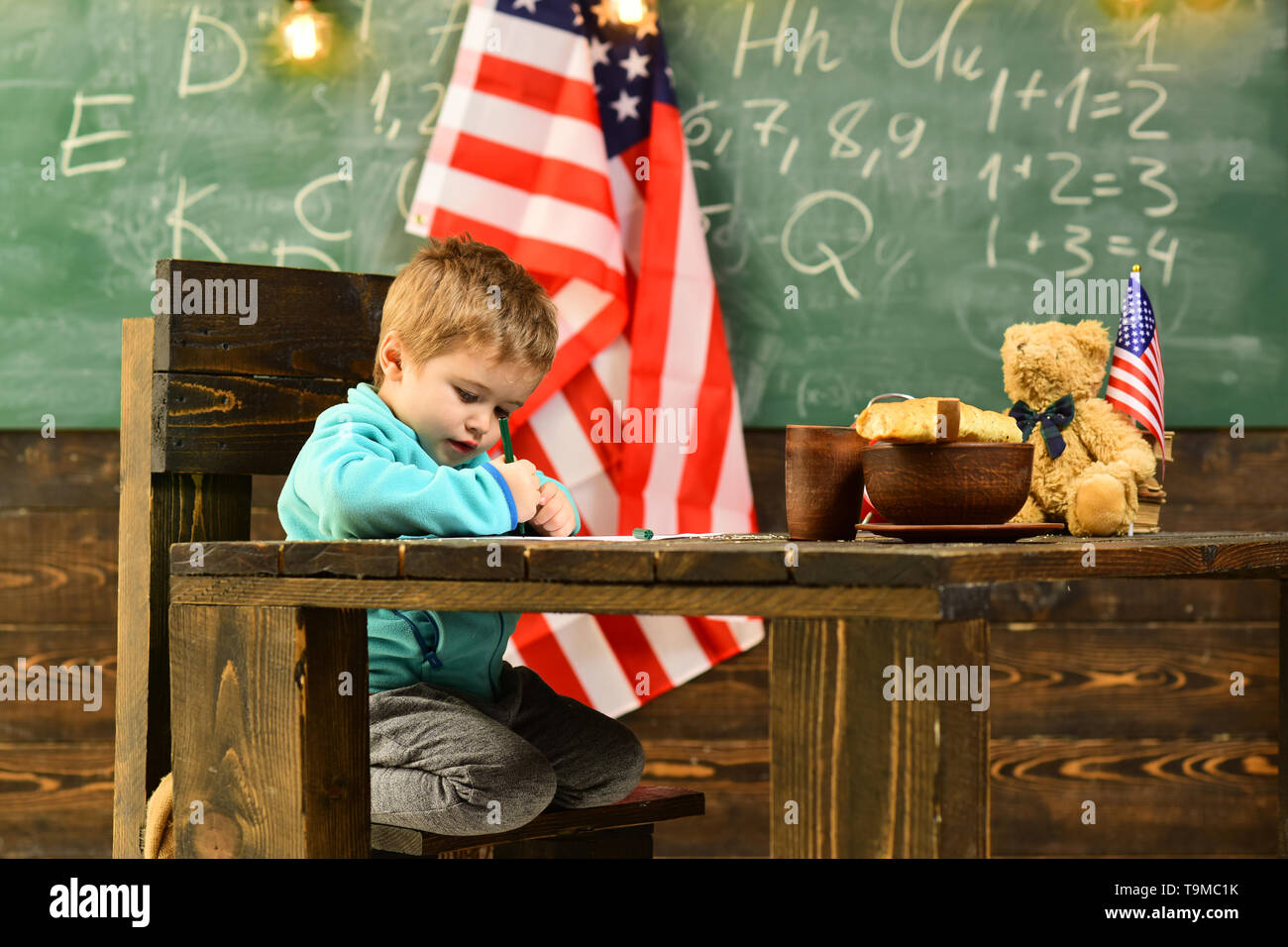 Happy kids at flag of United States on independence day of america. Stock Photo