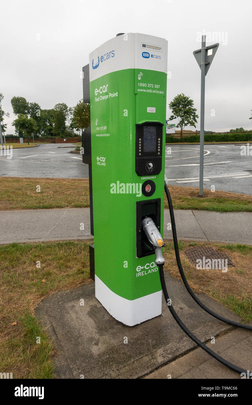 An e-car fast charge point for electric cars in the Junction 14 Mayfield M7 motorway service station in Eire. Stock Photo