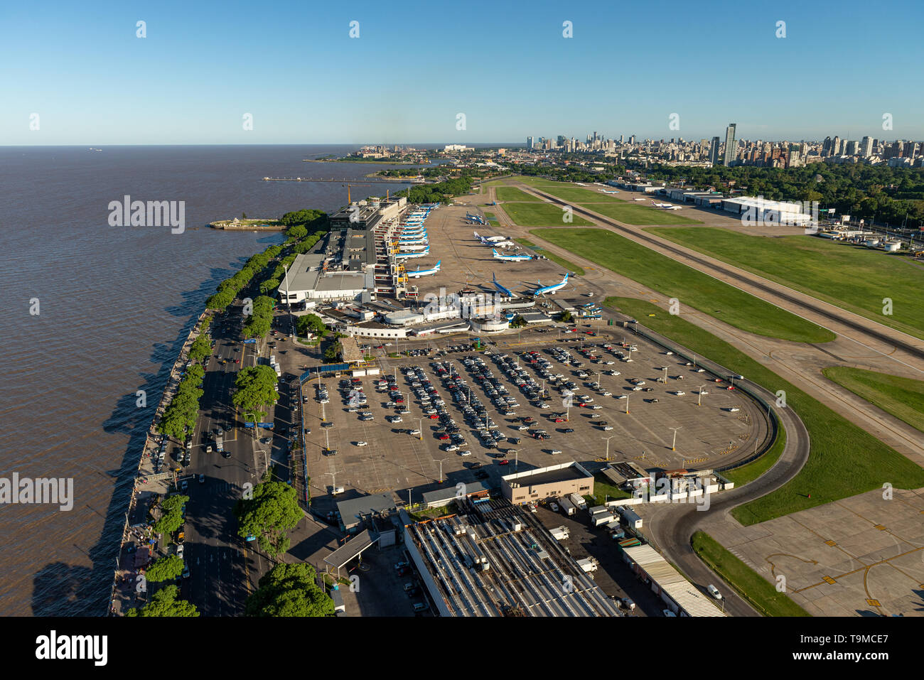 Aerial image showing the full Aeroparque Internacional Ing. Jorge Alejandro Newbery at the river Rio de la Plata with the city of Buenos Aires in the  Stock Photo