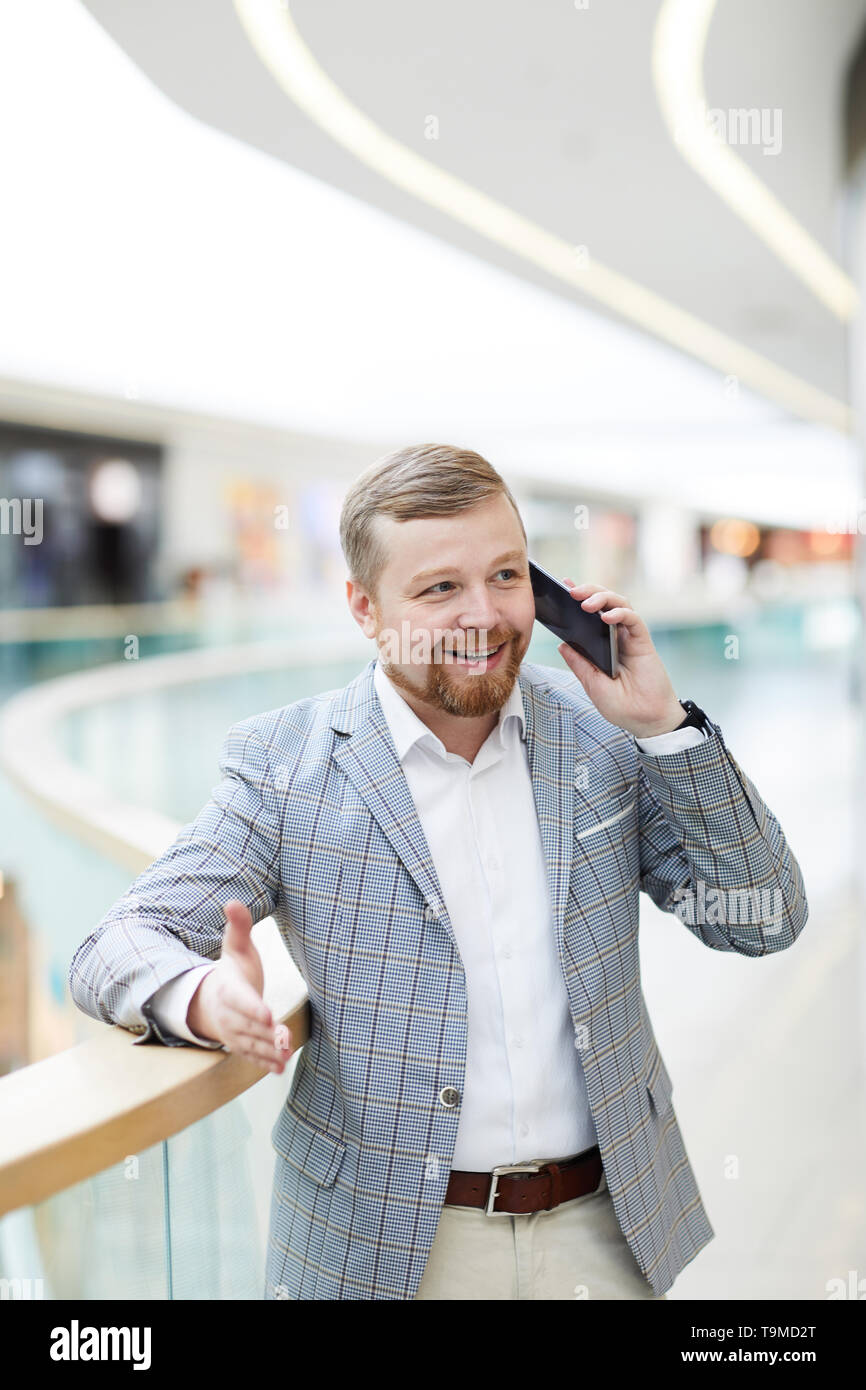 Content confident businessman on phone Stock Photo