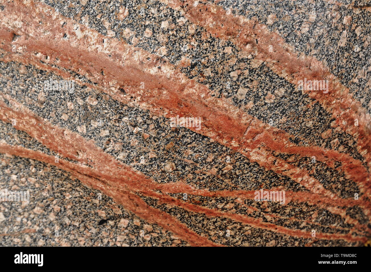 Red granite rock with reddish veins for sale-Jade Bazaar. Hotan-Xinjiang-China-0143 Stock Photo