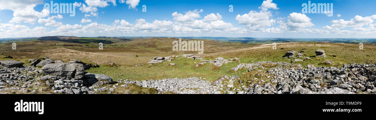 Panorama from Rippon Tor of Emsworthy Rocks, Saddle Tor and Haytor across Dartmoor, Devon, UK. Teignmouth and Newton Abbot are in the background. Stock Photo