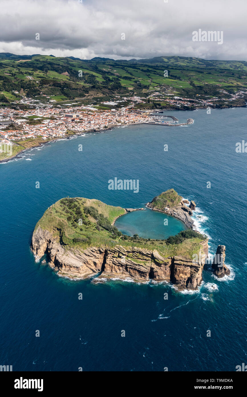 Aerial image of the idyllic islet of Vila Franca do Campo (Ilhéu de Vila Franca) with Vila Franca do Campo in the background  This is a tiny islet jus Stock Photo