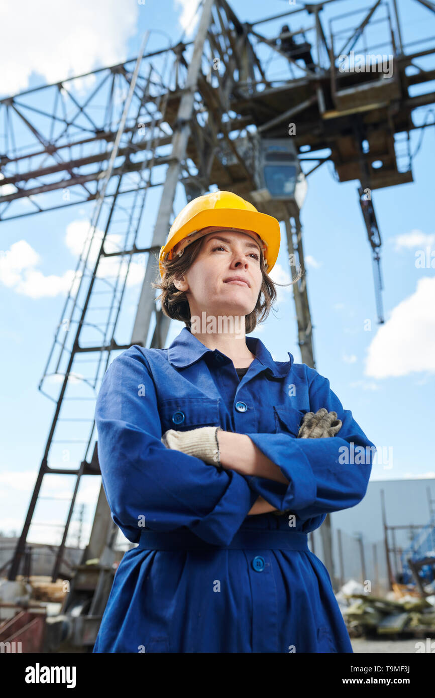 Smiling Woman at Construction Site Stock Photo