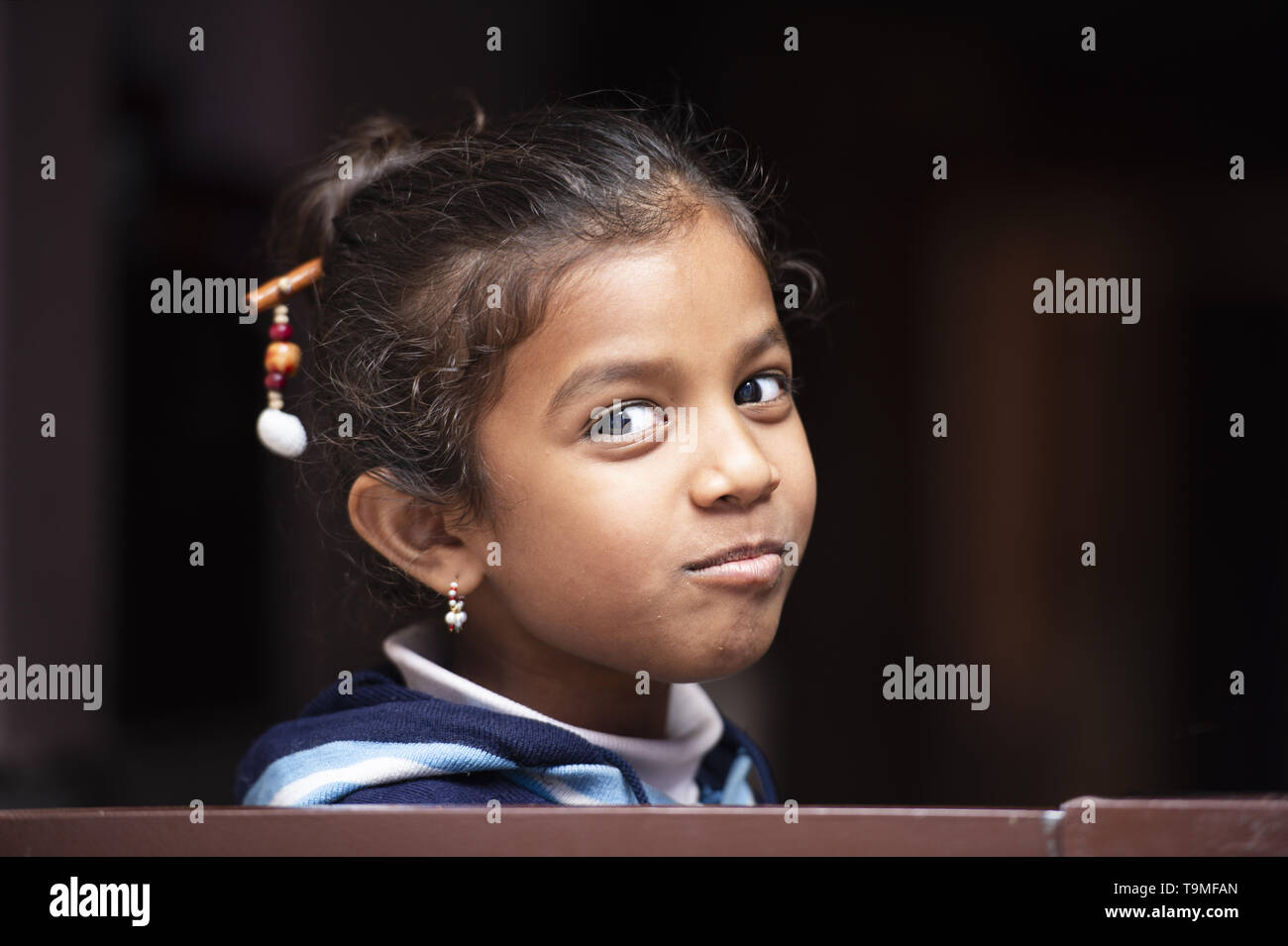 Portrait of a smiling little beautiful child in Varanasi. Varanasi is also known as Benares. Stock Photo