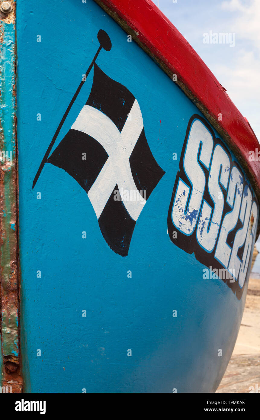 The Cornish flag painted on the bow of a St. Ives fishing boat Stock Photo