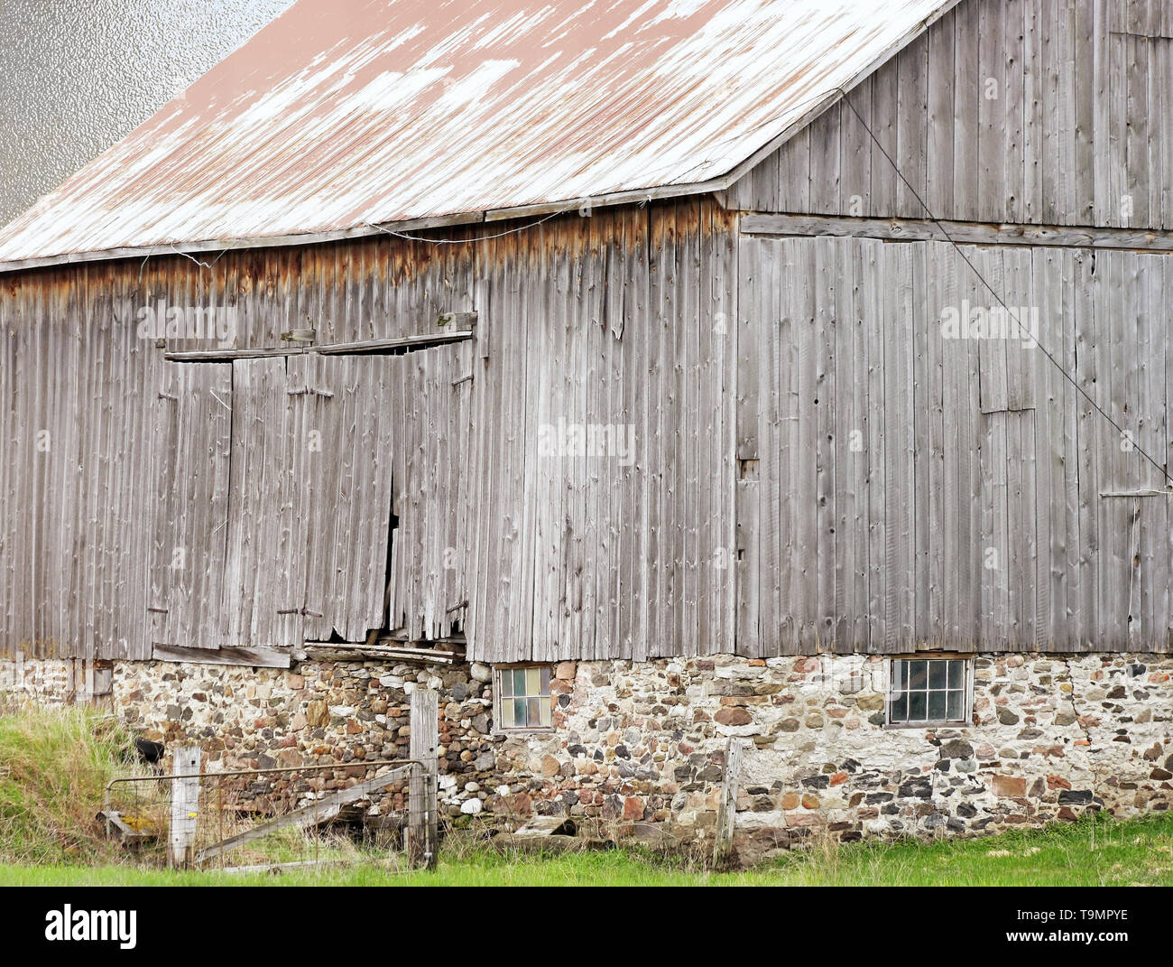 Old and weathered country barn with abstract background Stock Photo