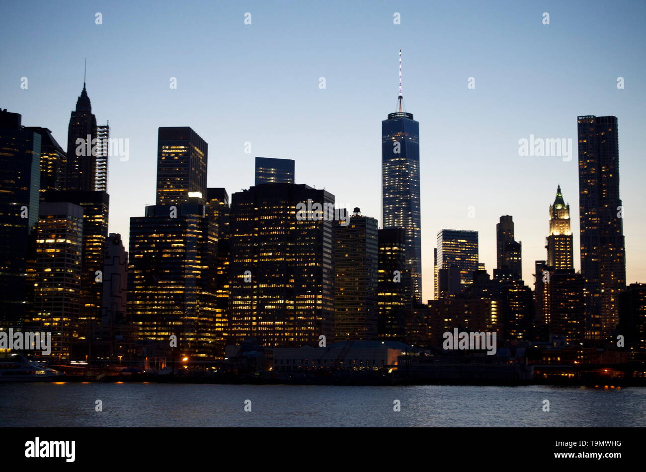 new york city downtown manhattan skyline at dusk, city lights Stock ...