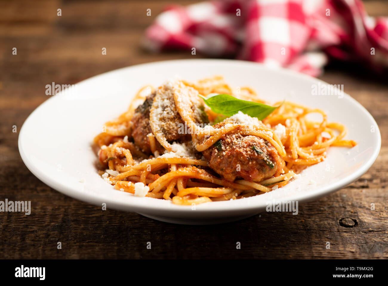 Beef meatballs with bolognese sauce and spaghetti. Close up Stock Photo