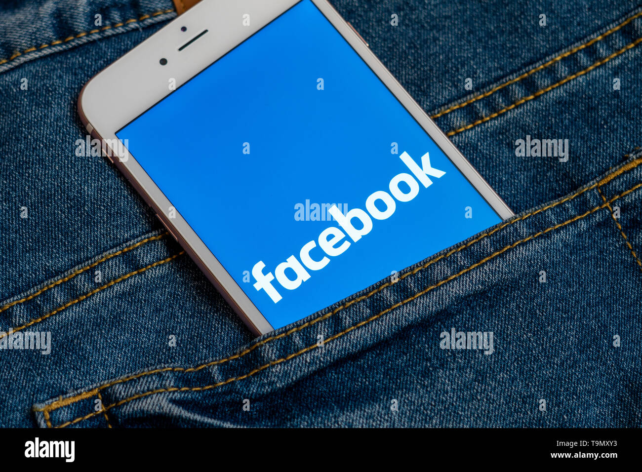 White iPhone with logo of social media Facebook on the screen ...