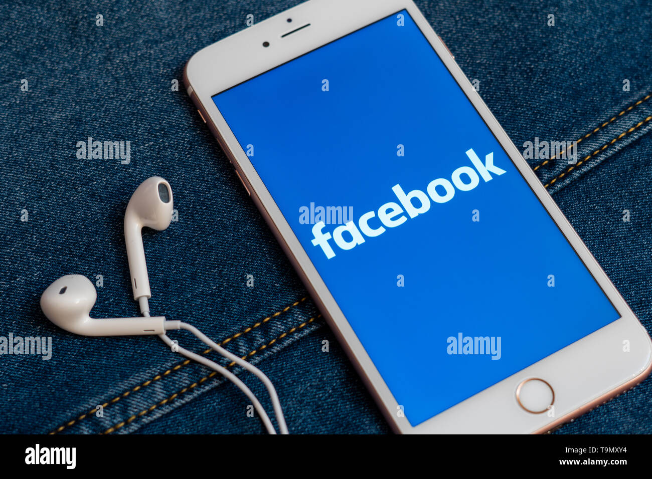 White iPhone with logo of social media Facebook on the screen ...
