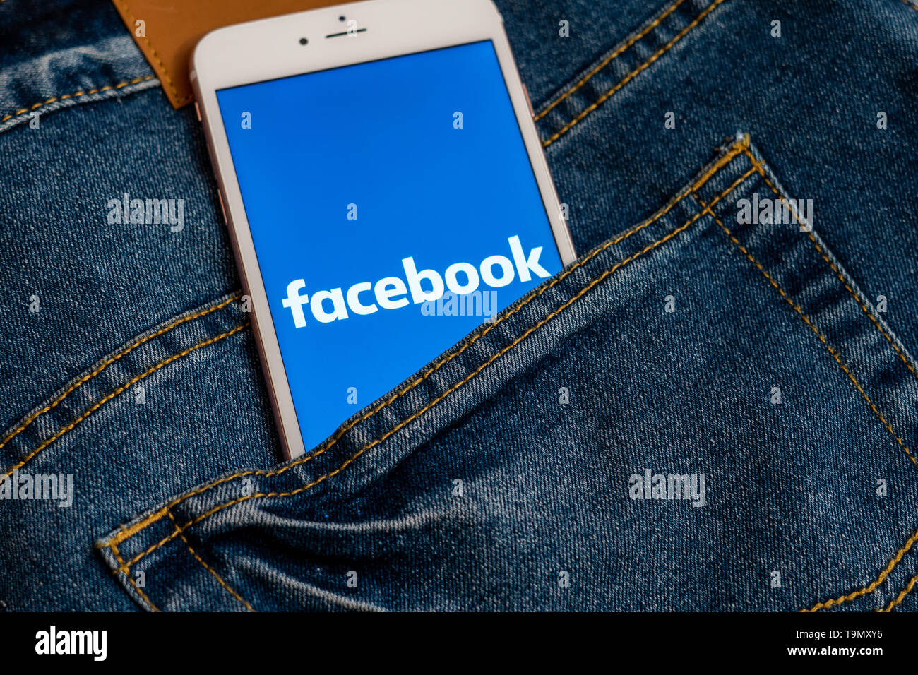 White iPhone with logo of social media Facebook on the screen ...
