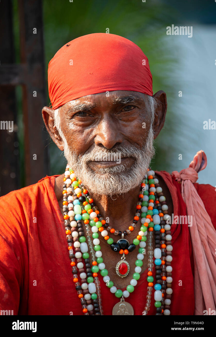 Man dressed as the saint Shirdi Baba in Shirdi, India Stock Photo