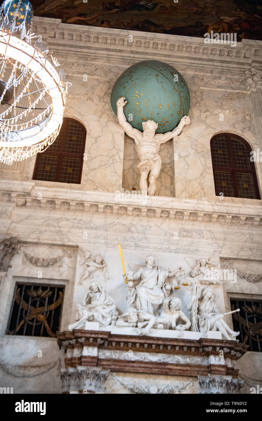 Atlas statue inside Royal Palace of Amsterdam in Dam Square - interior of Royal Palace - Dutch Palace - Palace in Amsterdam Netherlands Stock Photo