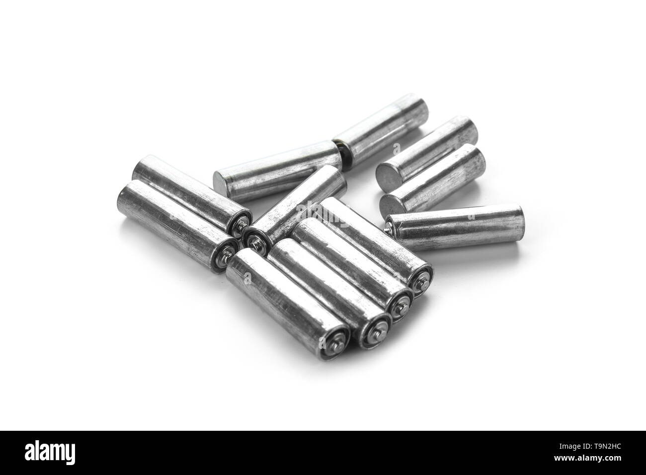 Used batteries on white background. Recycling concept Stock Photo