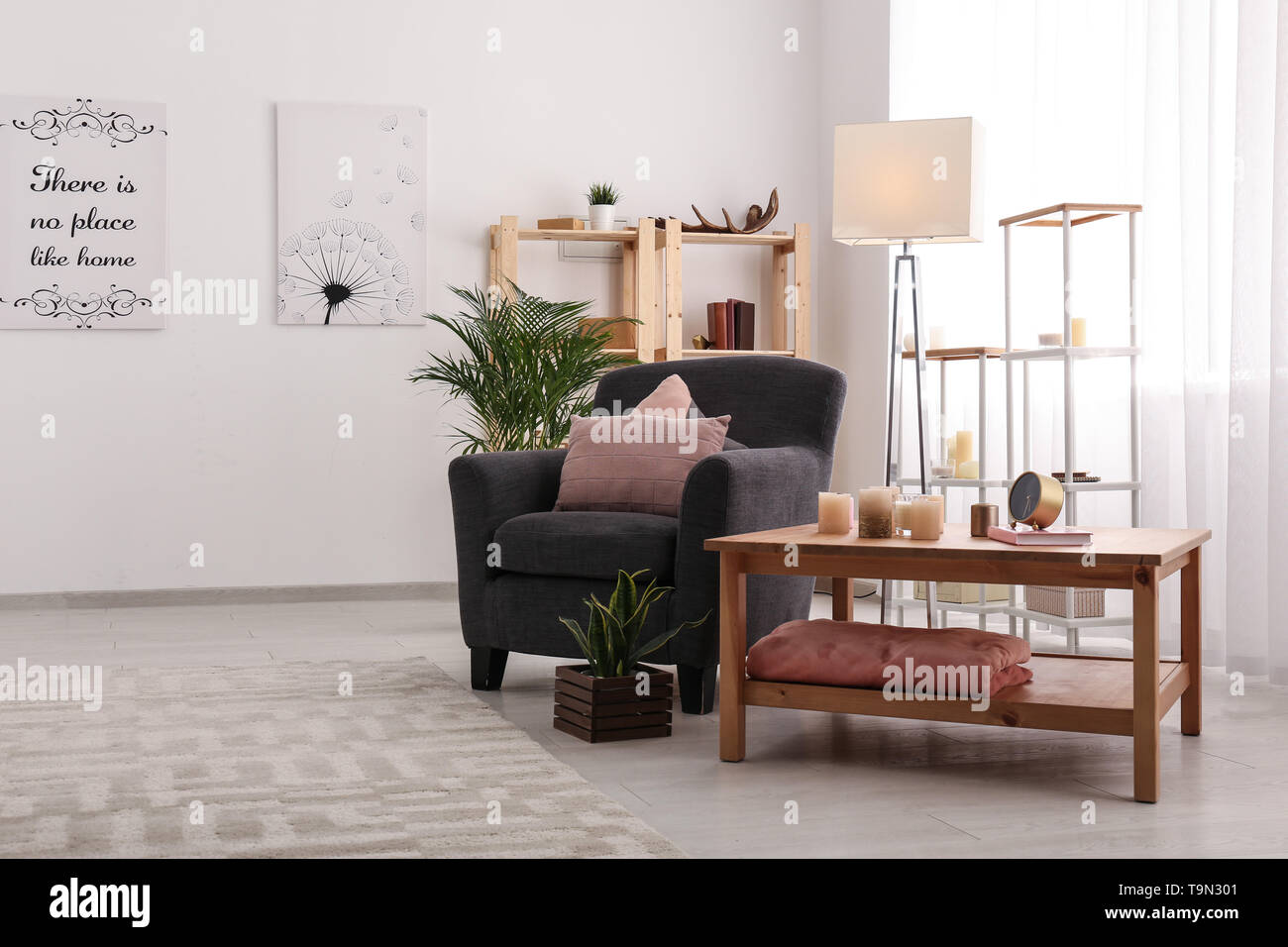 Interior of modern room with table and comfortable armchair Stock Photo ...