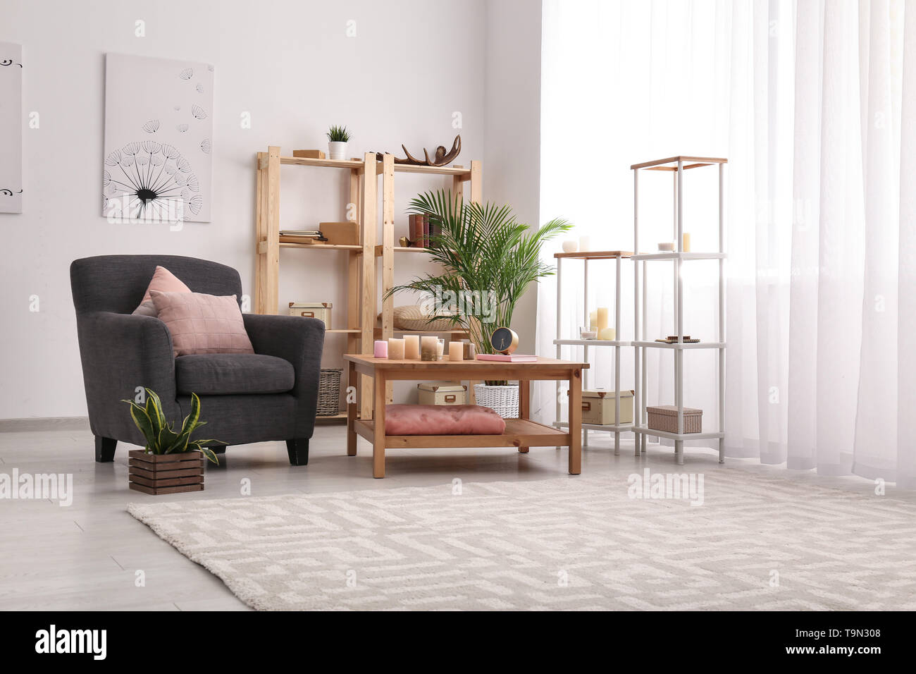 Interior of modern room with table and comfortable armchair Stock Photo ...