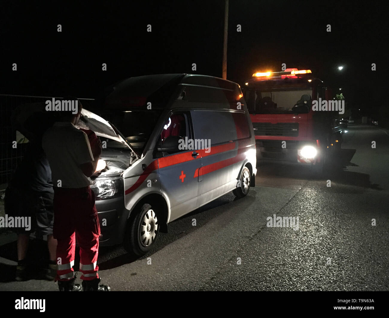 Ambulance with car problems during night Stock Photo
