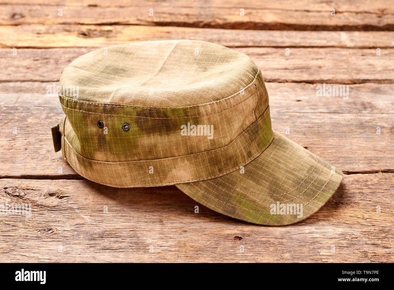 Military cap on wood. Stock Photo