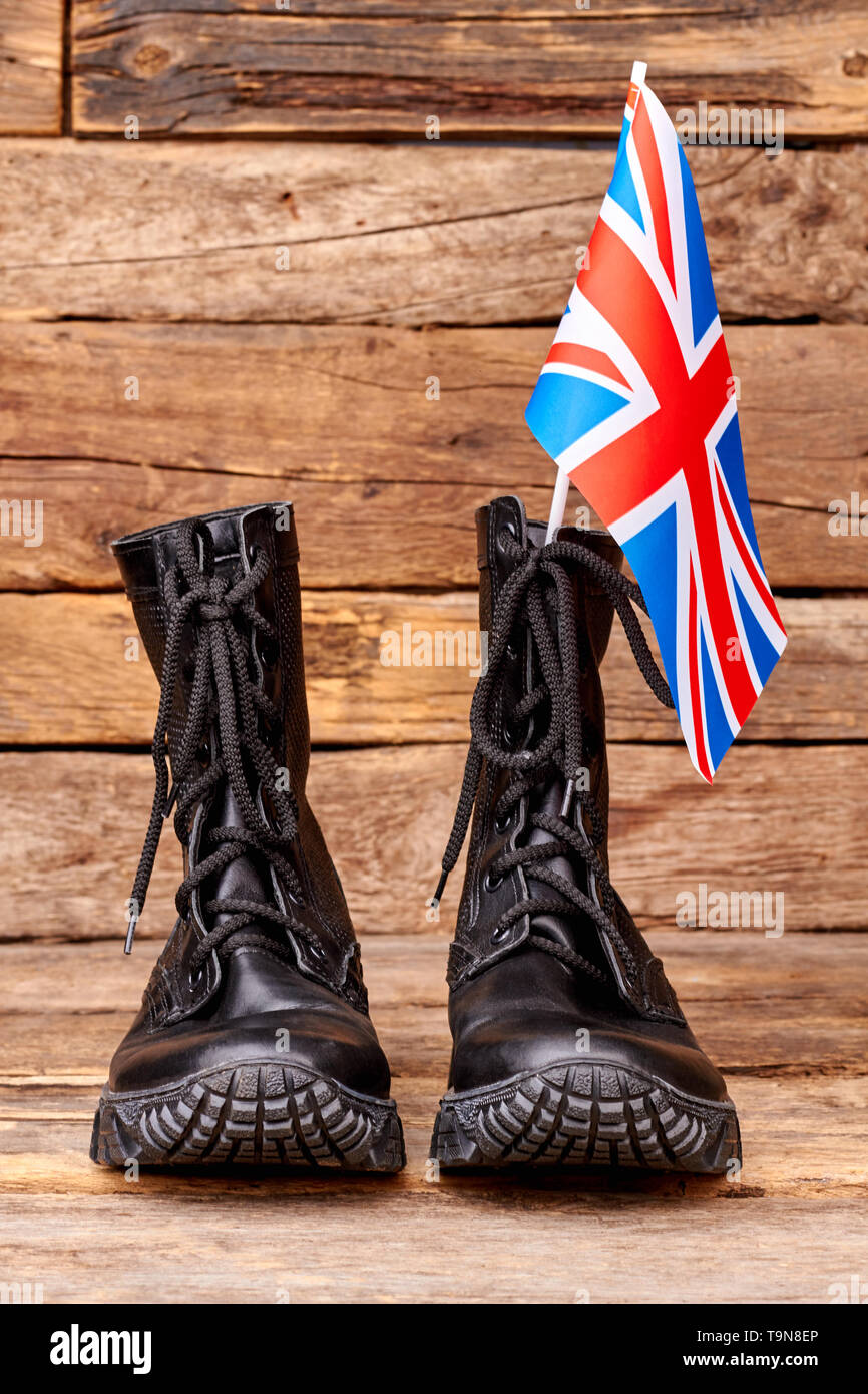 Pair of black combat boots with britain flag Stock Photo - Alamy