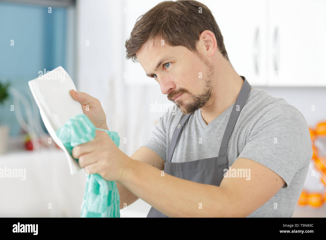 man washing dishes in the sink Stock Photo Alamy