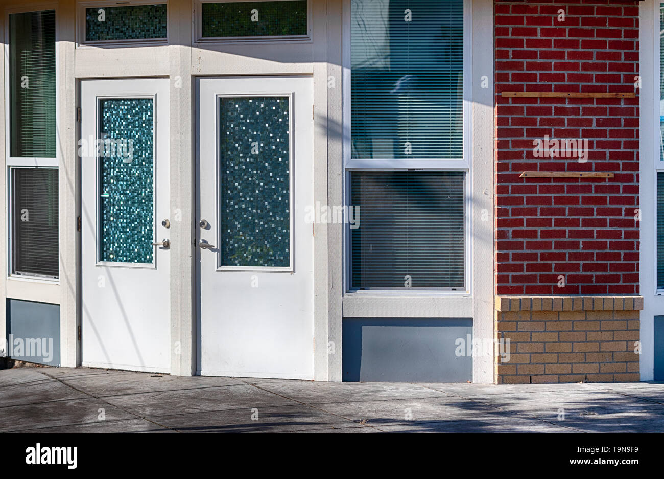 Old fashioned doors and window glass near a brick wall Stock Photo Alamy