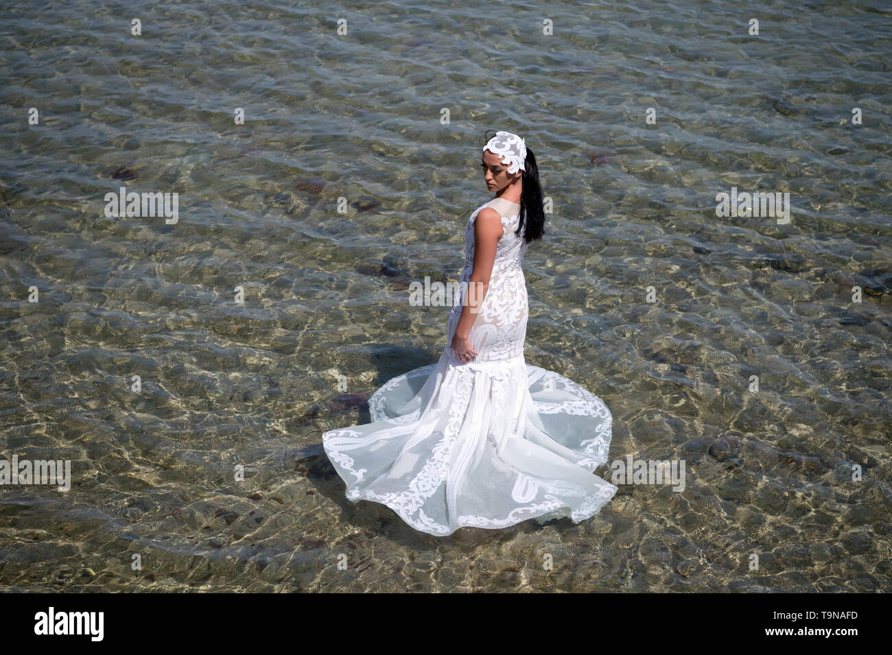 Wedding abroad. Wedding ceremony seashore. Bride white wedding dress