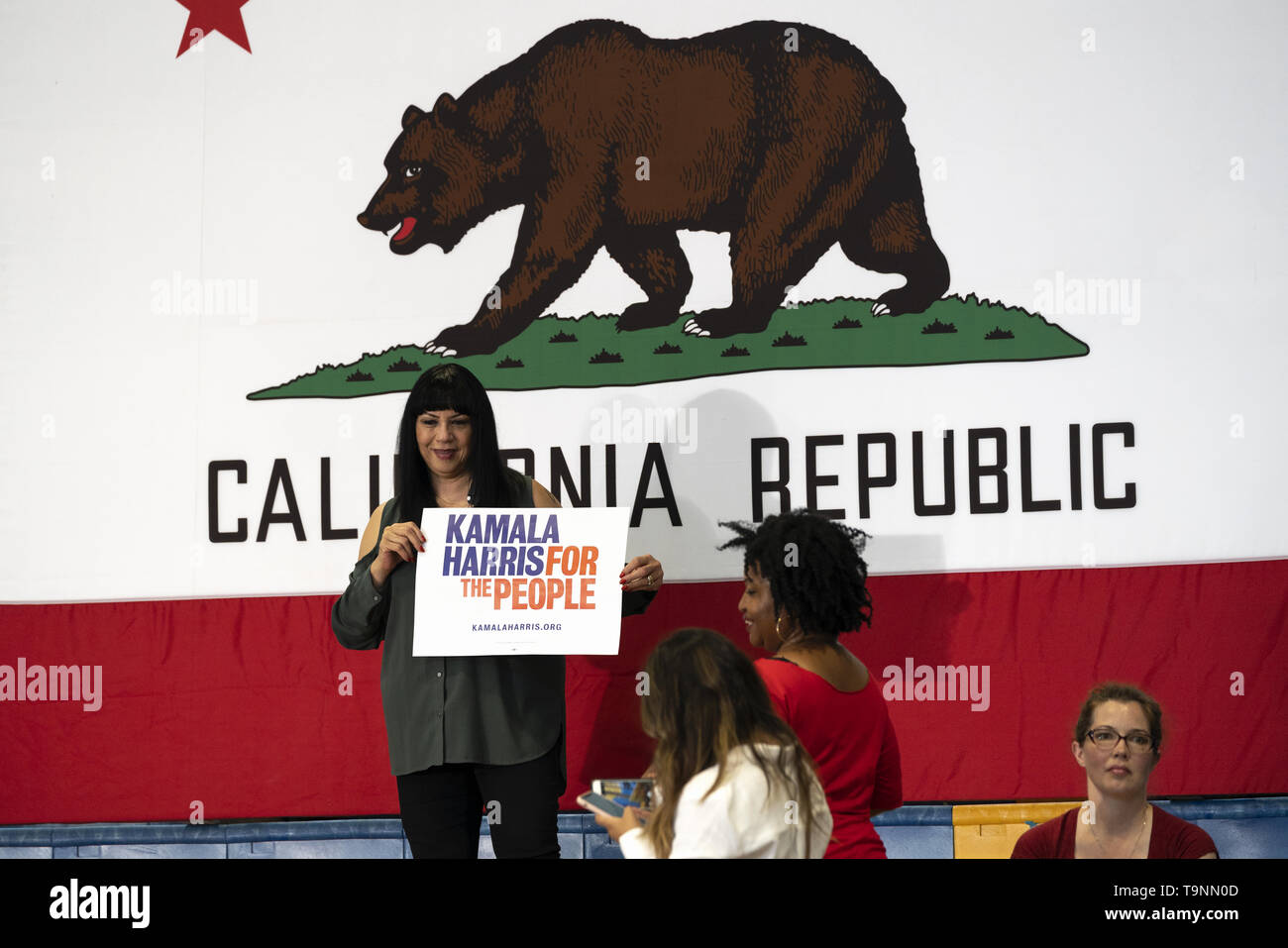 Los Angeles, CA, USA. 23rd Mar, 2019. Supporters of Democratic presidential candidate U.S. Senator Kamala Harris seen holding placards during a campaign rally in Los Angeles. This was Harris's first campaign rally in Los Angeles since she announced her candidacy for the President of the United States. The candidate spoke about the need to combat gun violence, raise teacher pay and provide middle class tax relief. Credit: Ronen Tivony/SOPA Images/ZUMA Wire/Alamy Live News Stock Photo