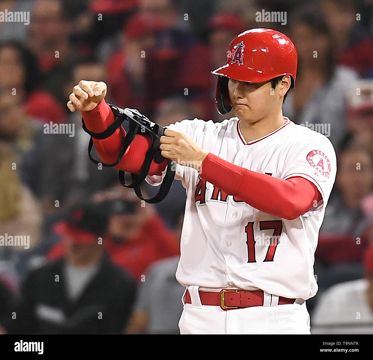 Los Angeles Angels designated hitter Shohei Ohtani wears his elbow brace at  first base after hitting a single in the fifth inning during the Major  League Baseball game against the Kansas City