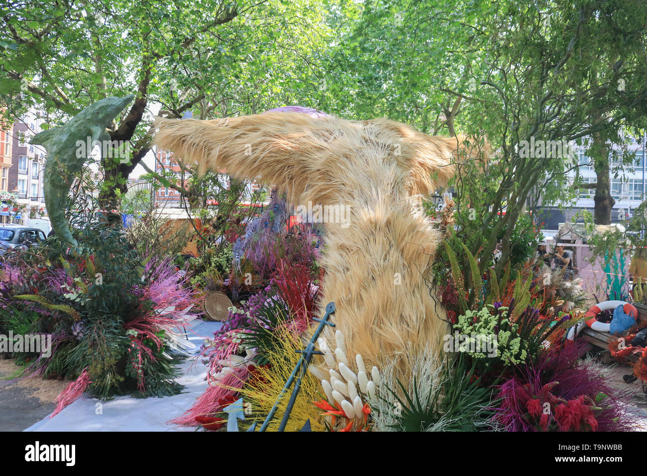 London, UK. 20th May, 2019. A sealife is created in Sloane Square asretailers in fashionable Chelsea decorate their store fronts with creative floral designs and displays to compete for the prestigious annual floral art show awards at the Chelsea in Bloom competition in association with the Royal Horticultural Society (RHS) coinciding with the Chelsea Flower Show. This year's theme is Under The Sea and the Environment Credit: amer ghazzal/Alamy Live News Stock Photo
