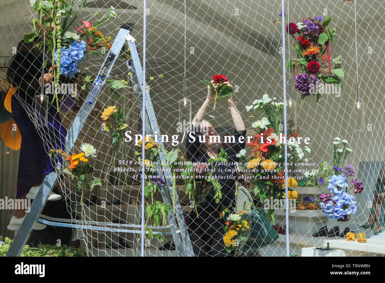 London, UK. 20th May, 2019. Shop owners decorate their windows as retailers in fashionable Chelsea decorate their store fronts with creative floral designs and displays to compete for the prestigious annual floral art show awards at the Chelsea in Bloom competition in association with the Royal Horticultural Society (RHS) coinciding with the Chelsea Flower Show. This year's theme is Under The Sea and the Environment Credit: amer ghazzal/Alamy Live News Stock Photo
